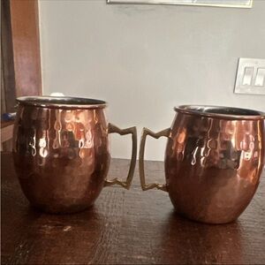 Never used. Hammered Copper Mugs with Brass Handles